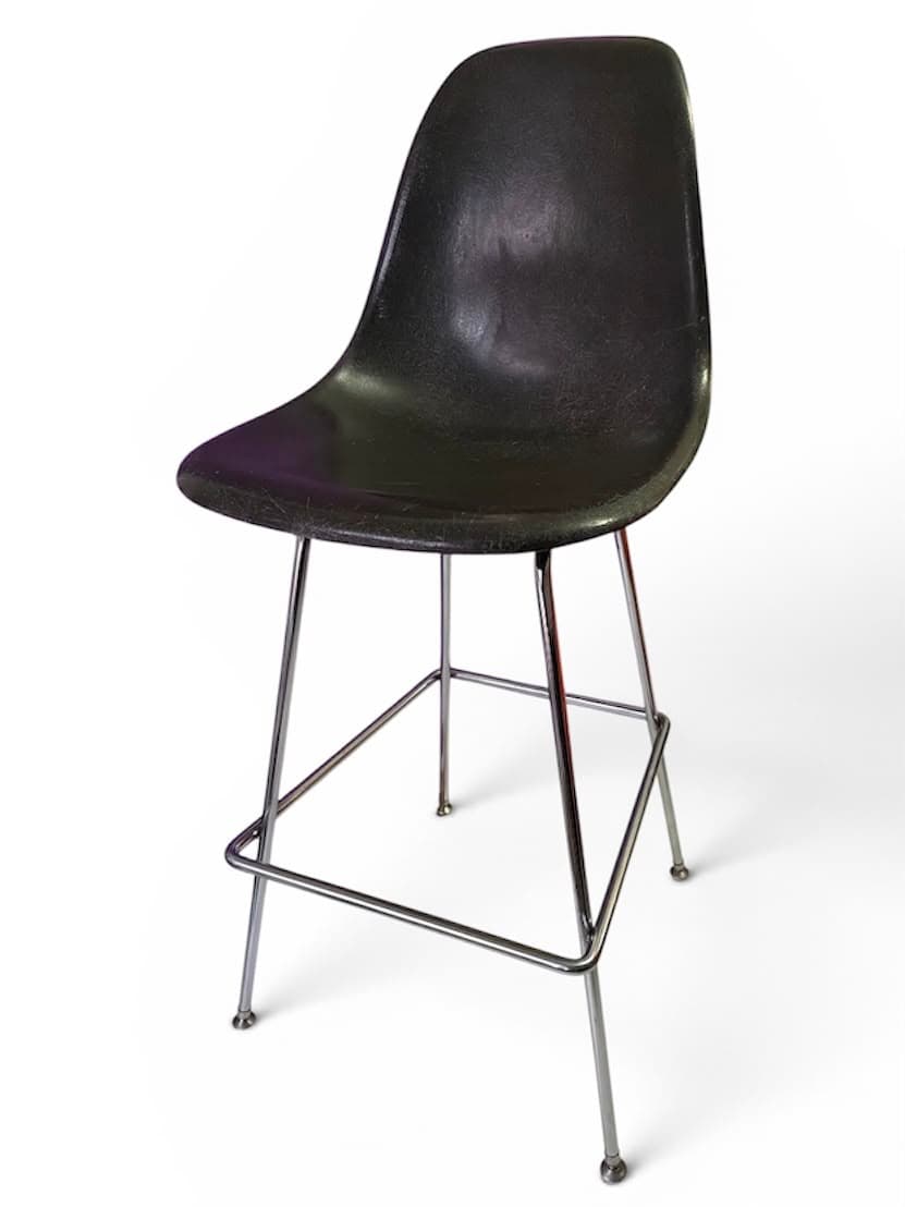 Black fibreglass shell bar stool on a chromed steel base, three-quarter view
