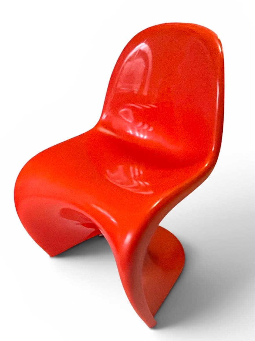 Gloss orange moulded cantilever chair, three-quarter view