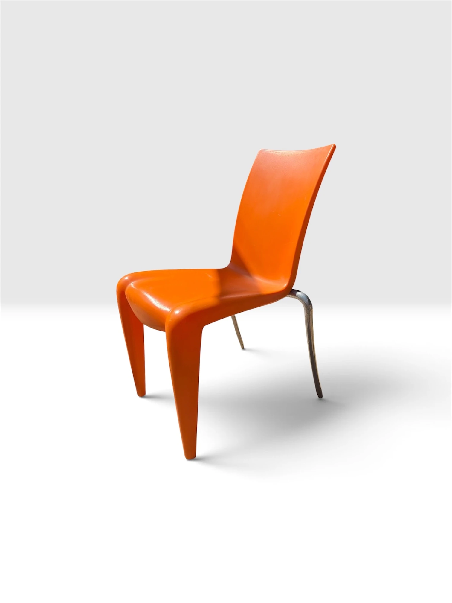 Philippe Starck Louis 20 chair for Vitra in orange, three-quarter view